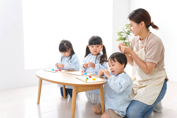 istock Children and teacher at kindergarten 1011929624