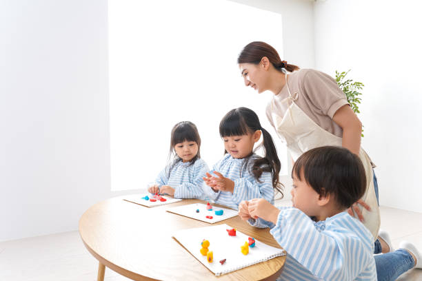 istock Children and teacher at kindergarten 1011929698