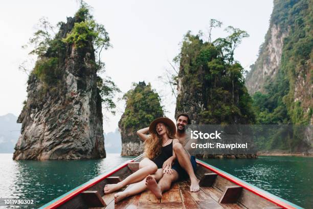 Couple Boating On A Quiet Lake Stock Photo - Download Image Now - Travel, Couple - Relationship, Vacations