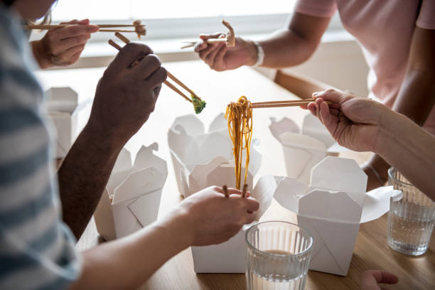 istock Friends eating Chow mein together 1011930384