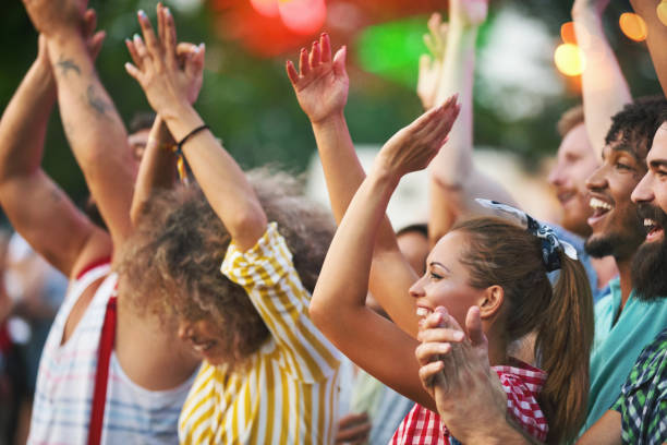 istock Friends dancing at a concert. 1011941002