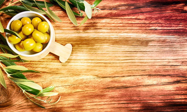 istock Olives on the wooden table 1011944988