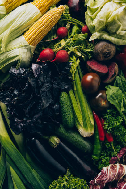 istock top view of corn cobs, radishes and eggplants on table 1011951266