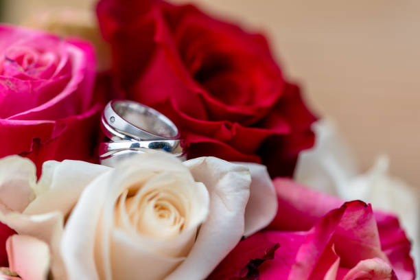 istock Wedding decoration and flowers with wedding rings 1011954326