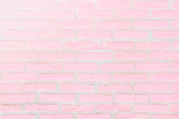 istock Cream and white brick wall texture background. Brickwork or stonework flooring interior rock old pattern clean concrete grid uneven bricks design stack. 1011955470