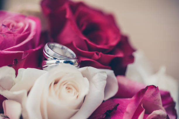istock Wedding decoration and flowers with wedding rings 1011955500