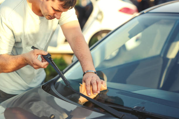 istock Man washing car -Car wash process with washing foam 1011957690
