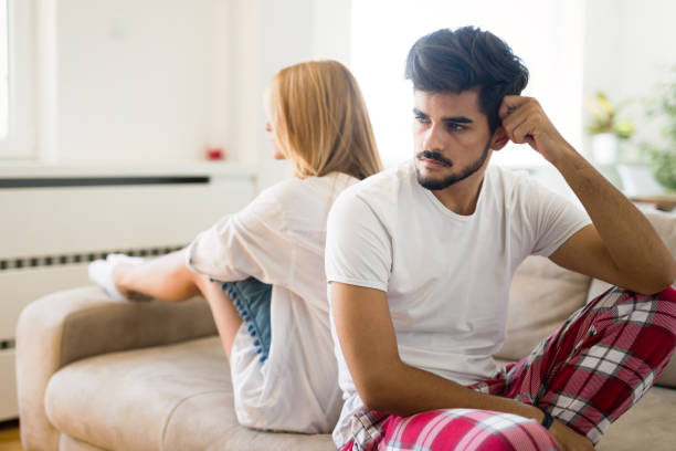 istock Worried couple having problems in bedroom 1011960066