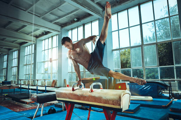 istock The sportsman during difficult exercise, sports gymnastics 1011969838