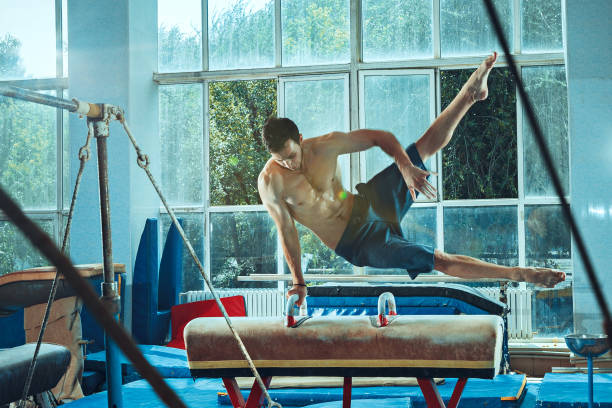 istock The sportsman during difficult exercise, sports gymnastics 1011970042