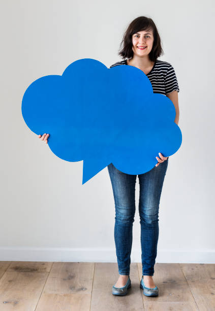 istock Happy Caucasian woman holding copyspace speech bubble 1011970832