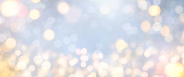 istock Christmas light background.  Holiday glowing backdrop. Defocused Background With Blinking Stars. Blurred Bokeh. 1011977568