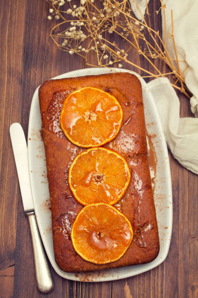 istock pumpkin cake with orange on white dish on wooden background 1011977706