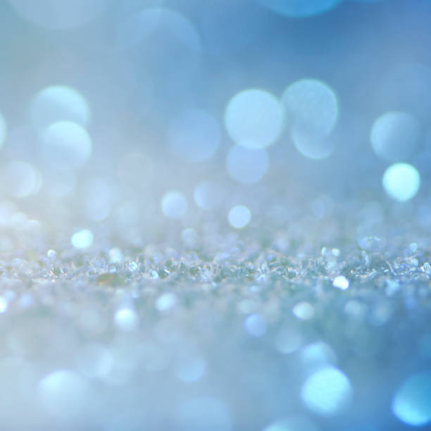 istock Christmas light background.  Holiday glowing backdrop. Defocused Background With Blinking Stars. Blurred Bokeh. 1011978036