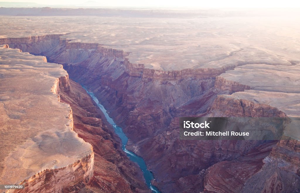 Canyon with a river Aerial Image of a canyon with a river flowing through it with cliffs on a warm sunny day in the evening Grand Canyon Stock Photo