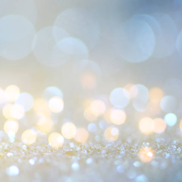 istock Christmas light background.  Holiday glowing backdrop. Defocused Background With Blinking Stars. Blurred Bokeh. 1011982554