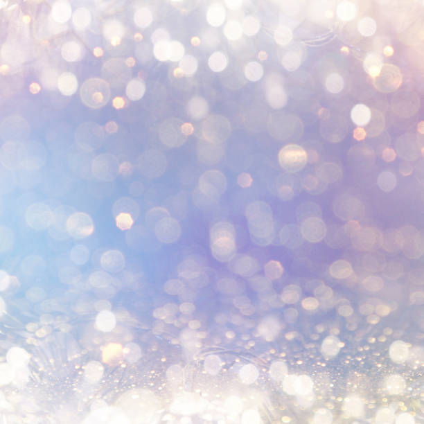 istock Christmas light background.  Holiday glowing backdrop. Defocused Background With Blinking Stars. Blurred Bokeh. 1011982810