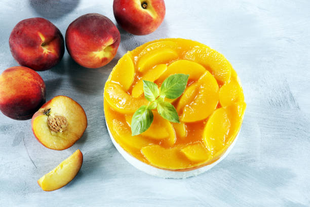 istock cheesecake with peache. Homemade cream cake with peaches 1011983932