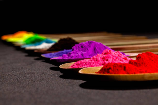 istock a row of colourful powder paint on black fabric 1011984222