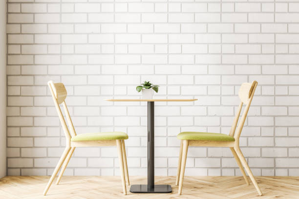 istock Wooden table and chairs in a minimalism cafe 1011989730
