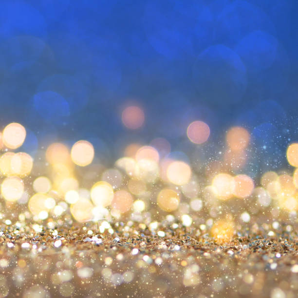 istock Christmas light background.  Holiday glowing backdrop. Defocused Background With Blinking Stars. Blurred Bokeh. 1011991876