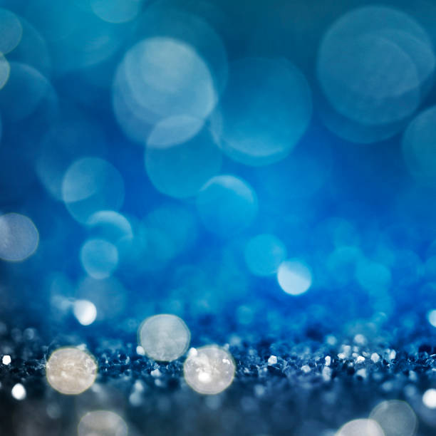 istock Christmas light background.  Holiday glowing backdrop. Defocused Background With Blinking Stars. Blurred Bokeh. 1011991894