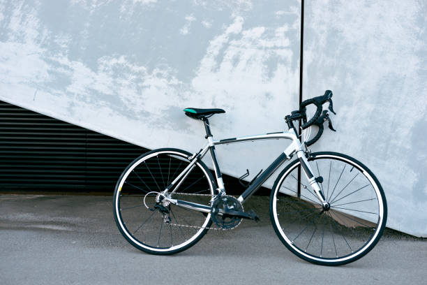 istock Racing bicycle standing next to concrete wall 1011993950