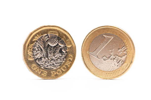 монеты евро и британского фунта - european union coin european union currency euro symbol coin стоковые фото и изображения