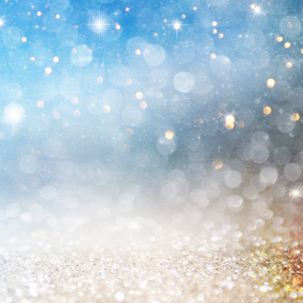 istock Christmas light background.  Holiday glowing backdrop. Defocused Background With Blinking Stars. Blurred Bokeh. 1012003044