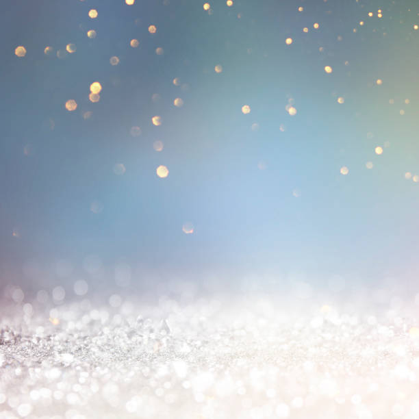 istock Christmas light background.  Holiday glowing backdrop. Defocused Background With Blinking Stars. Blurred Bokeh. 1012003074