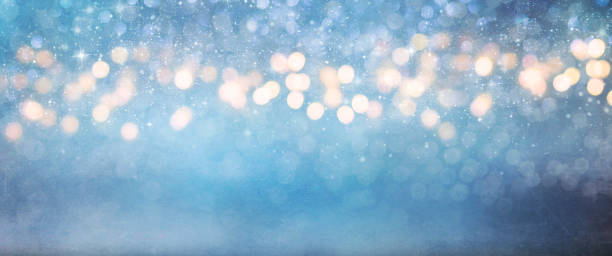 istock Christmas light background.  Holiday glowing backdrop. Defocused Background With Blinking Stars. Blurred Bokeh. 1012004714