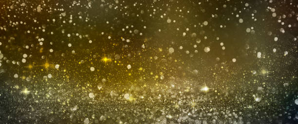 istock Christmas light background.  Holiday glowing backdrop. Defocused Background With Blinking Stars. Blurred Bokeh. 1012004864