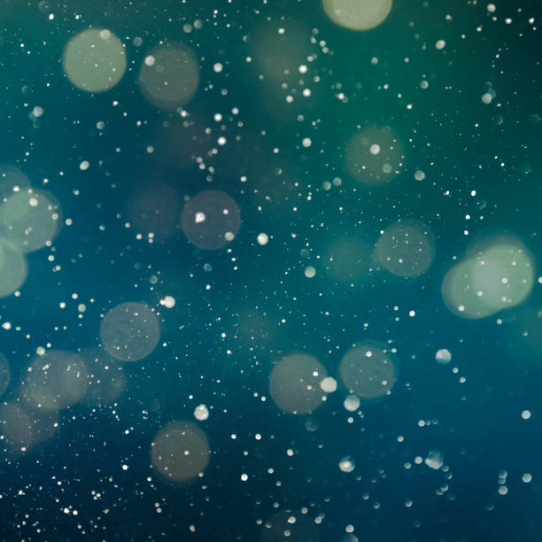 istock Christmas light background.  Holiday glowing backdrop. Defocused Background With Blinking Stars. Blurred Bokeh. 1012007196