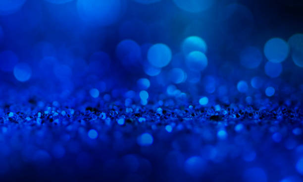 istock Christmas light background.  Holiday glowing backdrop. Defocused Background With Blinking Stars. Blurred Bokeh. 1012015750