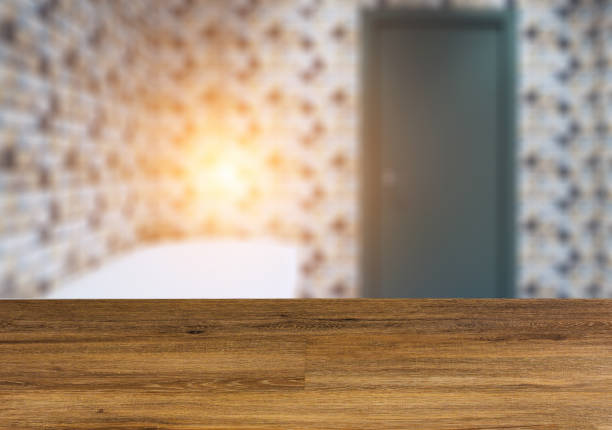 istock Clean and fresh bathroom with natural light.  The wooden table. Blurred interior. 1012026816