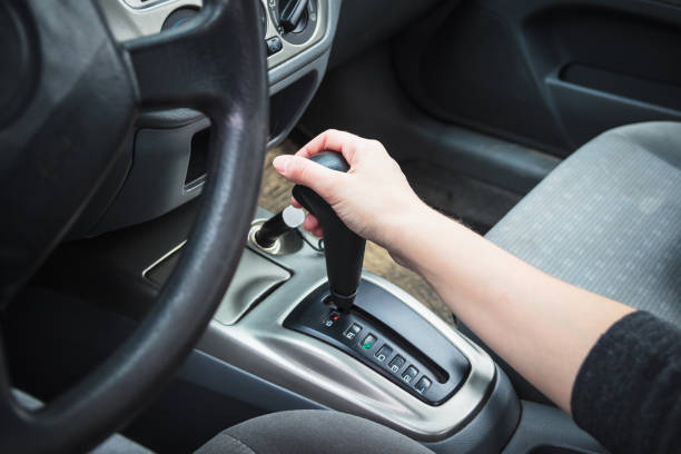 Female hand on the shift lever automatic transmission. stock photo