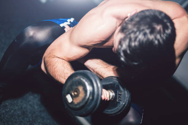 istock Young handsome man exercise in the gym. 1012032132