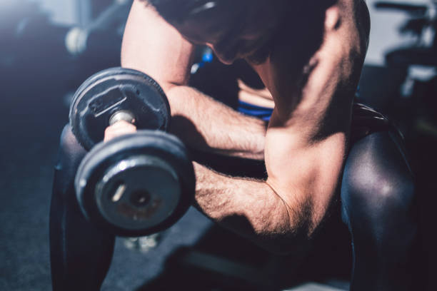 istock Young handsome man exercise in the gym. 1012035846