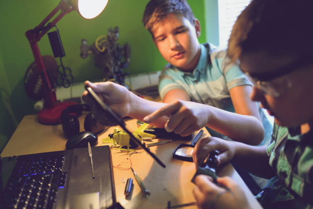 istock Little engineers! Look at this man, this will be a new and better version 1012045374