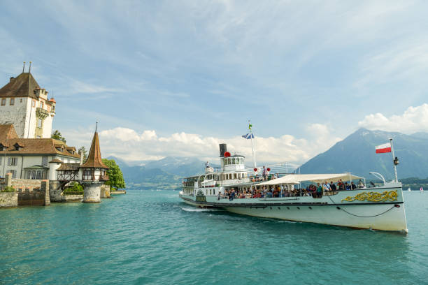 Oberhofen, Switzerland - June 16, 2018: Old steamship near castle Oberhofen on Thunersee in Switzerland during June 2018