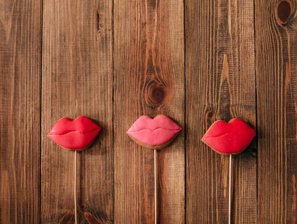 istock holiday cookies icing lips red stick gingerbread 1012063074