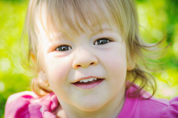 istock happy little girl portrait 1012063546