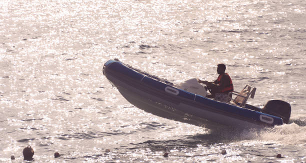 Bow of white inflatable rubber speed motor boat