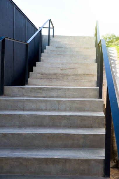 istock looking down to aged concrete staircase.Old stone stairs. 1012087300