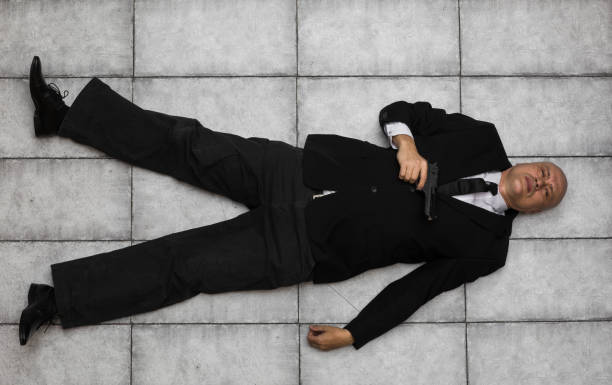 istock FBI agent in  suit and with a gun 1012087956