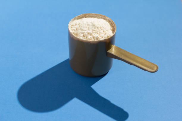 istock Close-Up Of Whey Protein In Spoon On Blue Table 1012090640