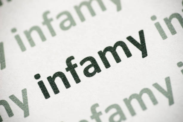 istock word infamy printed on paper macro 1012094942