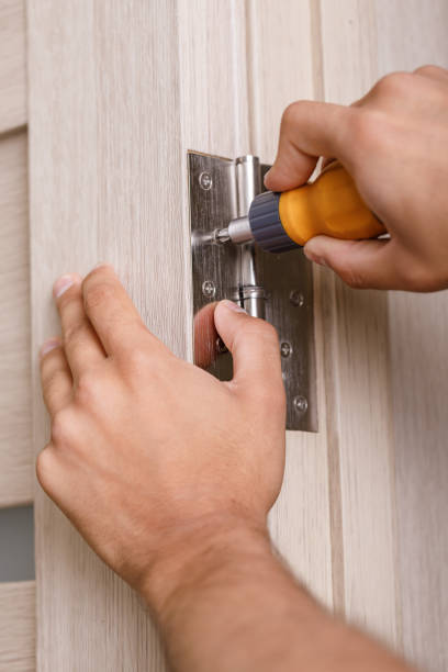 istock screwdriver installs door hinges 1012095810