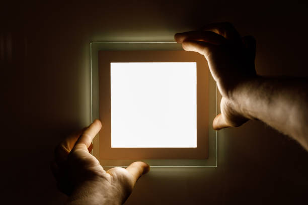 istock electrician installs an LED light 1012099778
