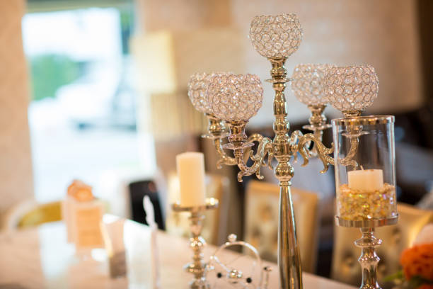 istock the elegant crystal candlestick decorated with white candles in dinning room, wedding aniversary 1012099992